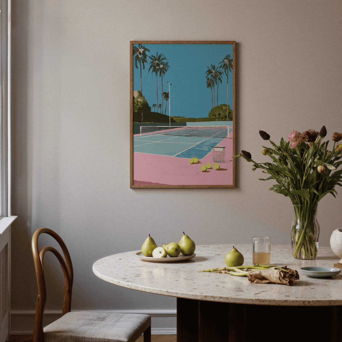 Foreground tennis balls and basket on a tennis court print with tall palm trees