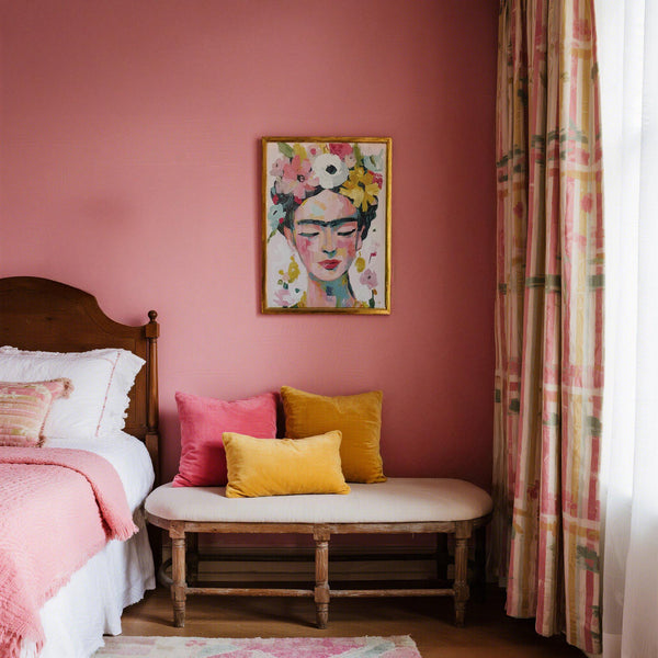 Minimalist space with paintings of Frida Kahlo in pastel tones on the wall.