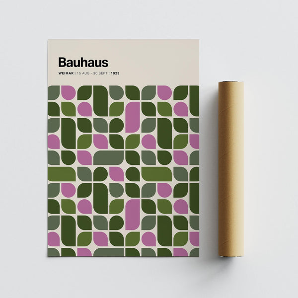 Interior view with Bauhaus Exhibition 1923 print framed above a desk.