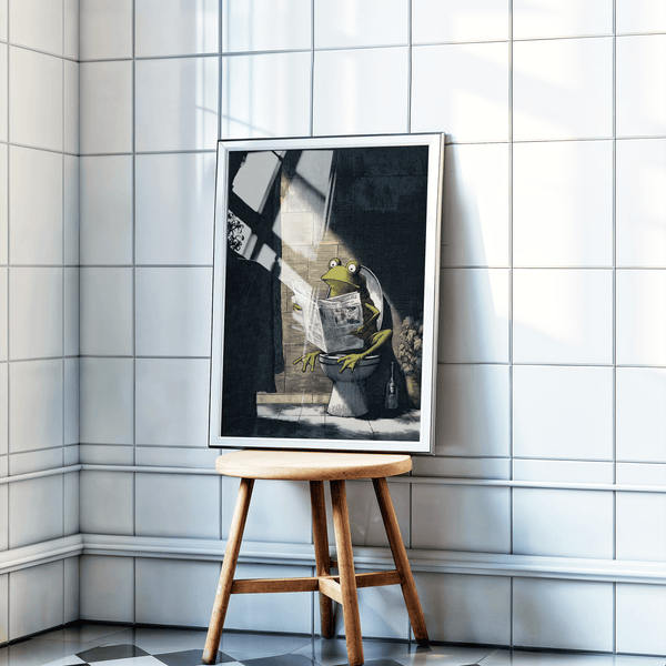 Funny Frog Art Print showing a wide-eyed frog reading a newspaper on a toilet