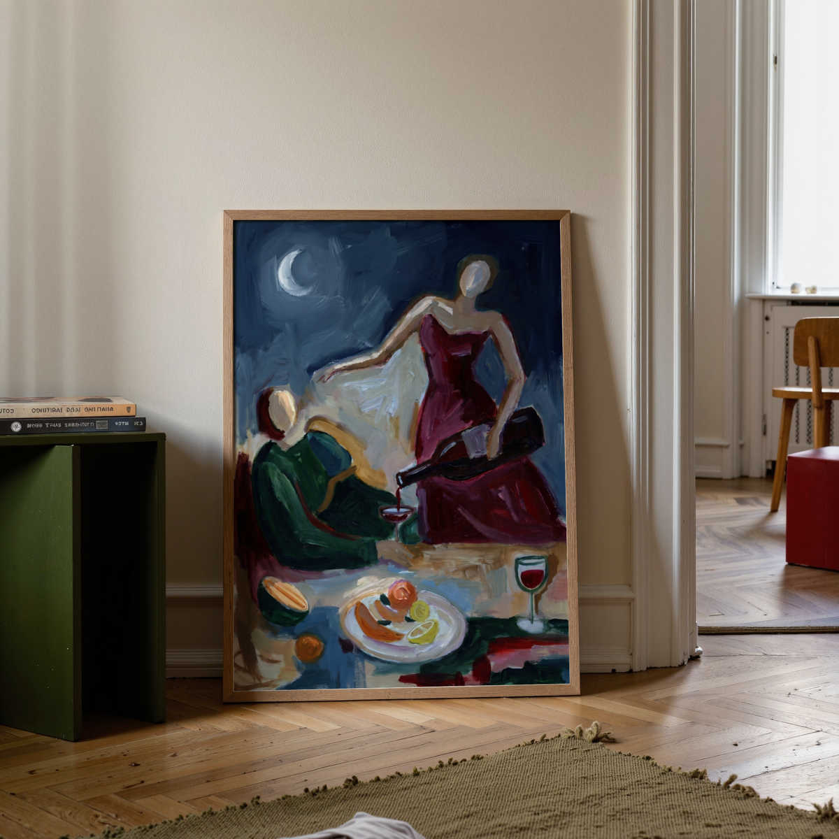 Loose brushstroke dinner table wall art with two figures, plate of fruit, and moonlit background