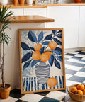Orange blue wall art featuring fruit and foliage with textured brushstroke background.