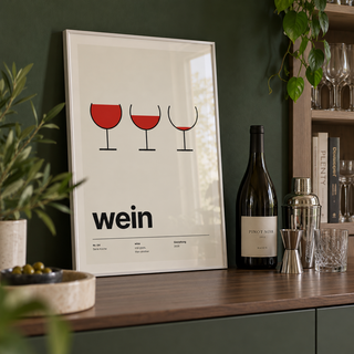 Three emptying wine glasses print in a drinks cabinet against a green wall