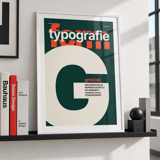 Giant letter G typography print leaning on a picture ledge