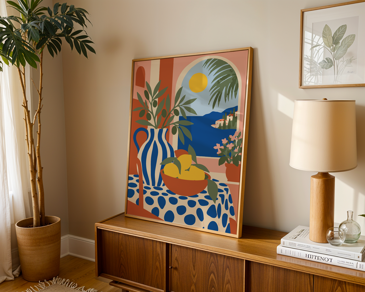 Italian coast print with a table of lemons leaning on a wooden sideboard in a warm living room