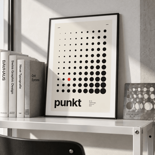 Halftone dot grid print leaning on a picture ledge