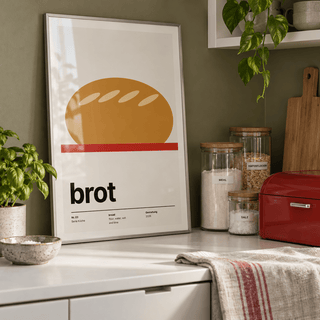 Scored loaf on a red board print in a pantry cabinet against an olive wall