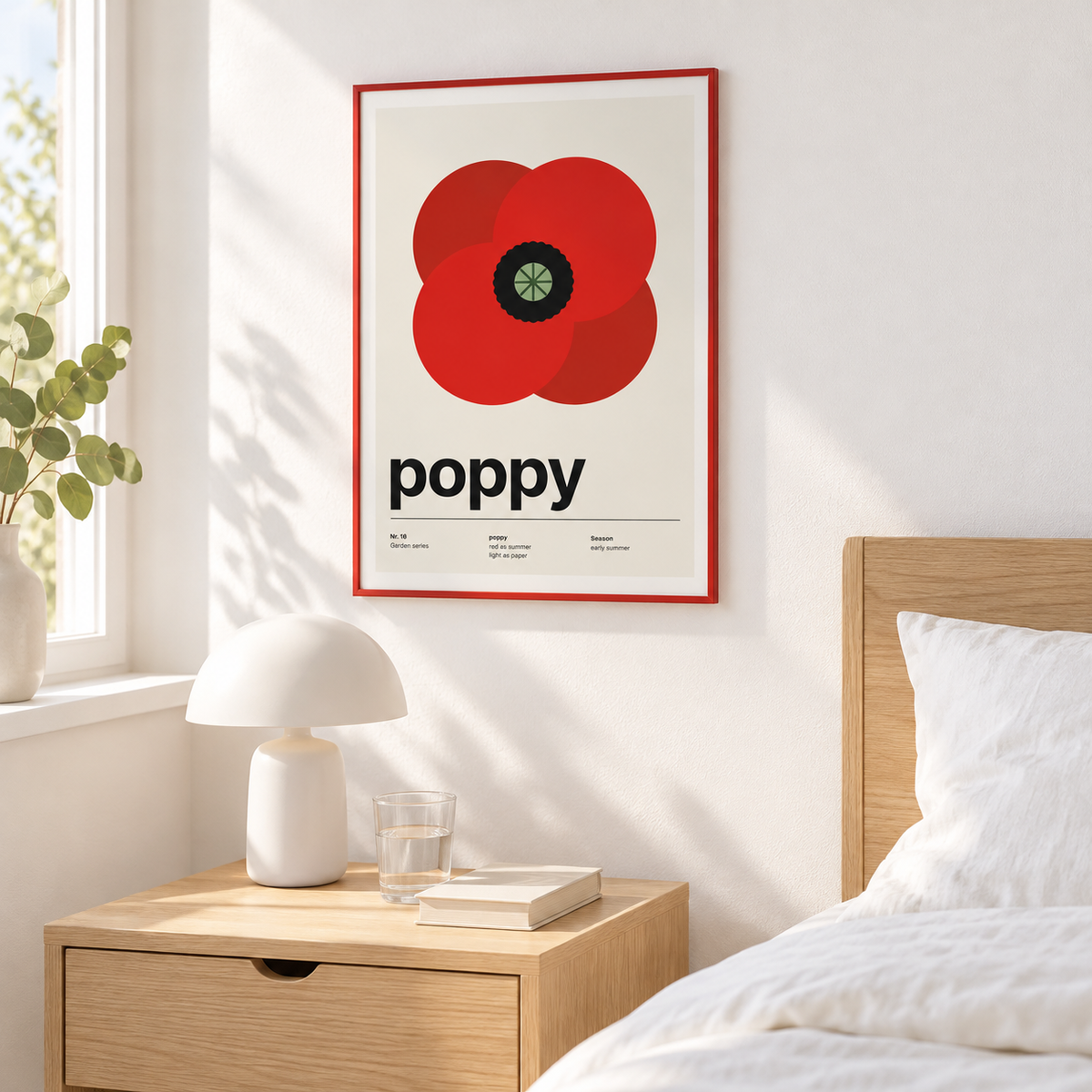 Red poppy print above a bedside table in a calm bedroom