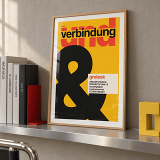 Giant black ampersand print leaning on a picture ledge