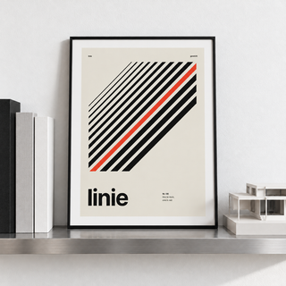 Diagonal black lines print leaning on a picture ledge