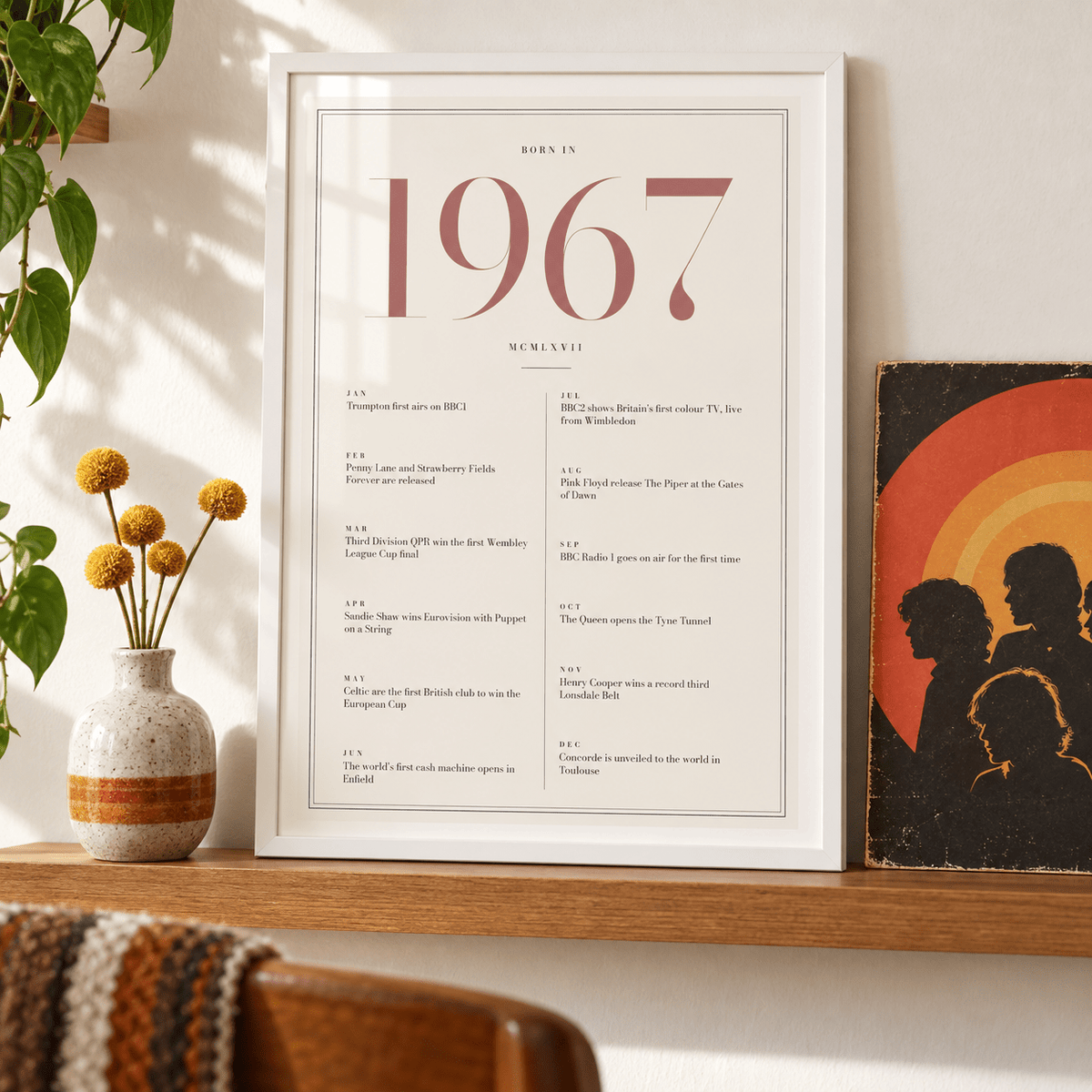 1967 year print with dusty rose numerals on cream above simple furniture at home
