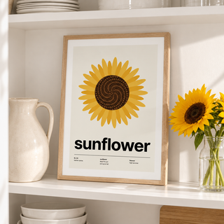 Sunflower head from above print on a kitchen shelf beside jars and plants