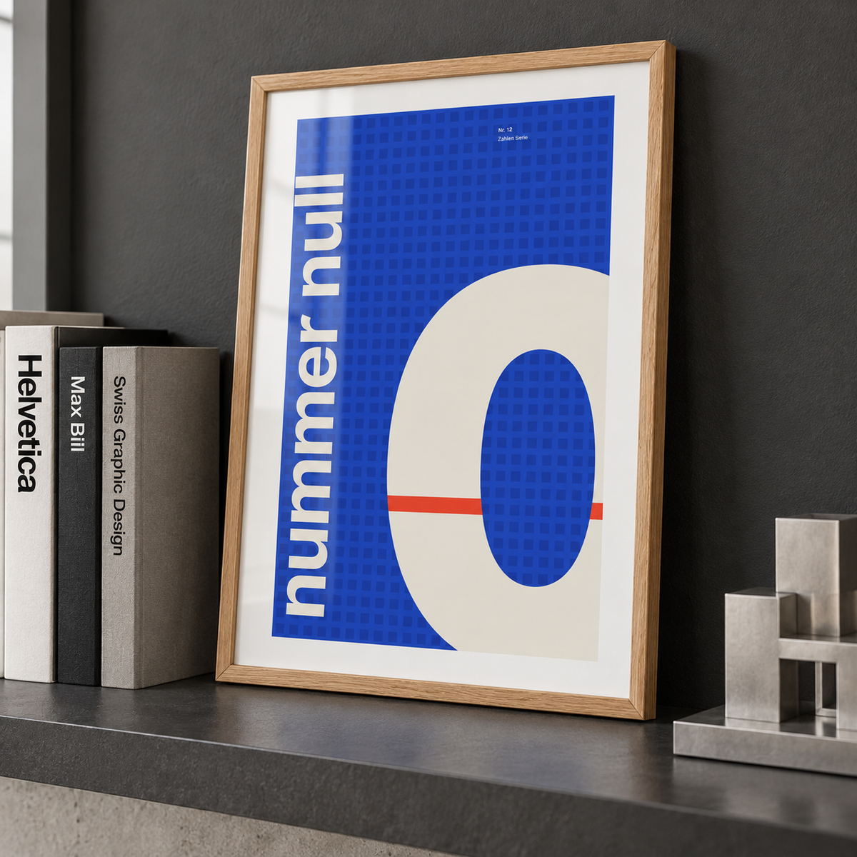 Giant cream number 0 on cobalt print leaning on a picture ledge