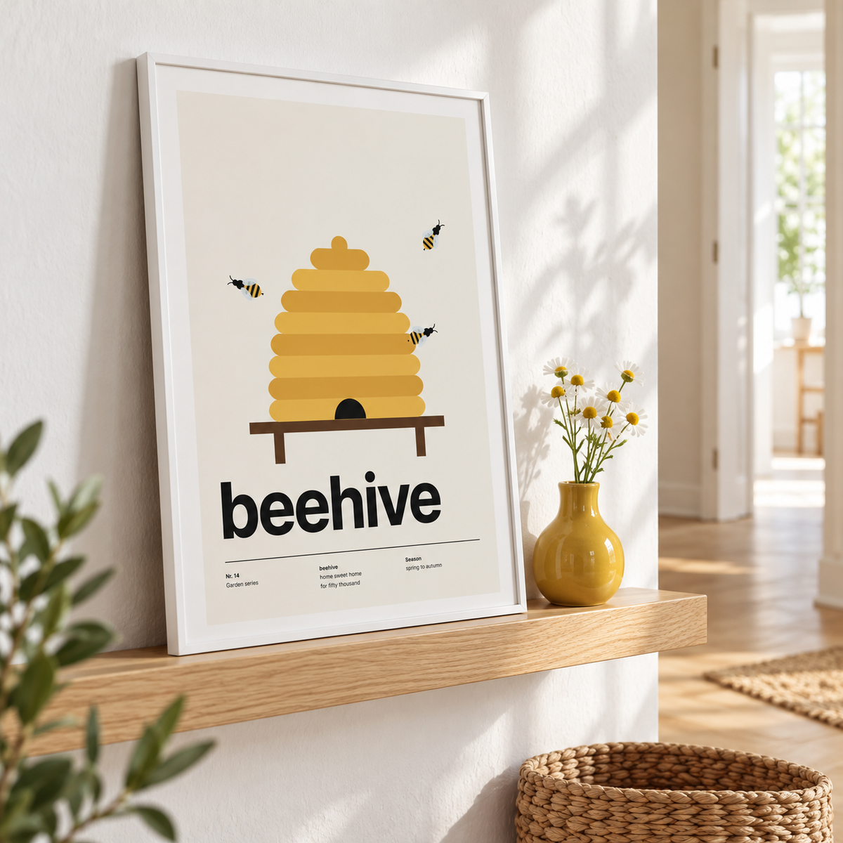 Beehive print leaning on a ledge beside a yellow vase