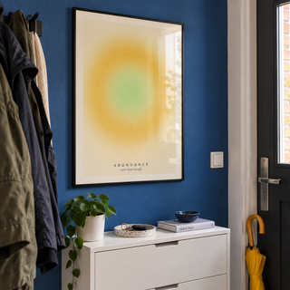 Golden yellow aura print in a hallway against a cobalt wall