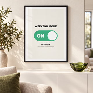 Weekend mode on switch print above a wooden sideboard in a living room