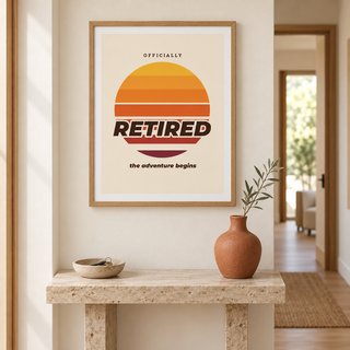 Retro sunset retired print above a console table in a hallway