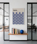 Structured simple wall art with repeating blue pattern on soft beige.