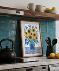 Contemporary Sunflower Print featuring a bouquet in a striped jug with botanical leaves.