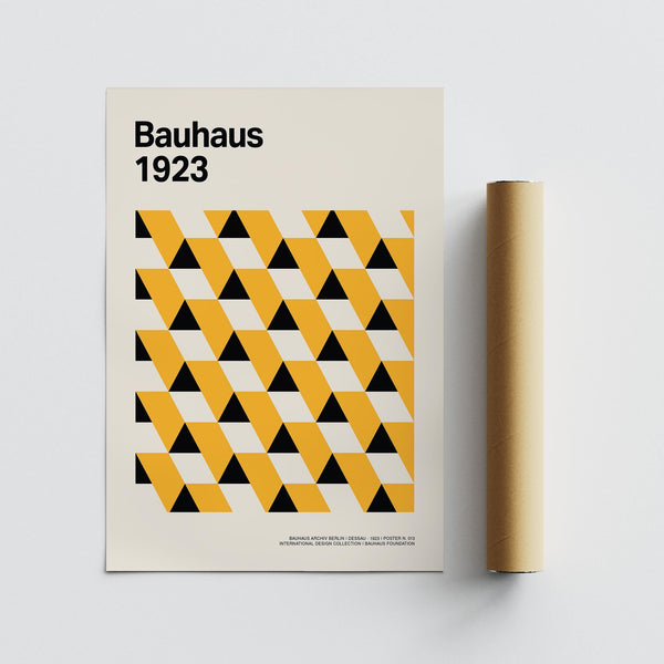 Modern wall display with bold Bauhaus Poster 1923 in creative workspace.