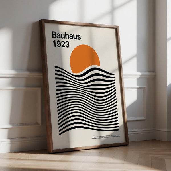 A bold Sun and Mountain Wall Art print featuring black wave lines and an orange sun on beige background.