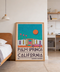 Vintage-style travel wall art print of Palm Springs with car in foreground and strong negative space sky