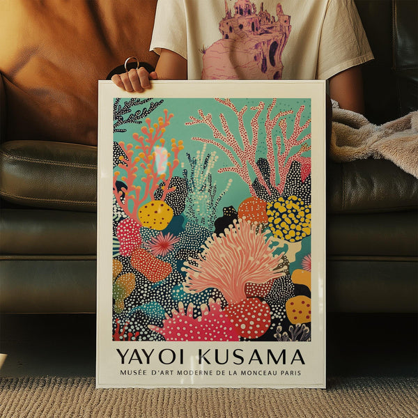 Bold bright wall art with red, orange, and yellow coral against a blue sea