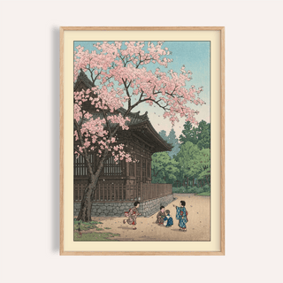 Framed wall view of Hasui Kawase Poster showing cherry blossoms, temple, and children on a path
