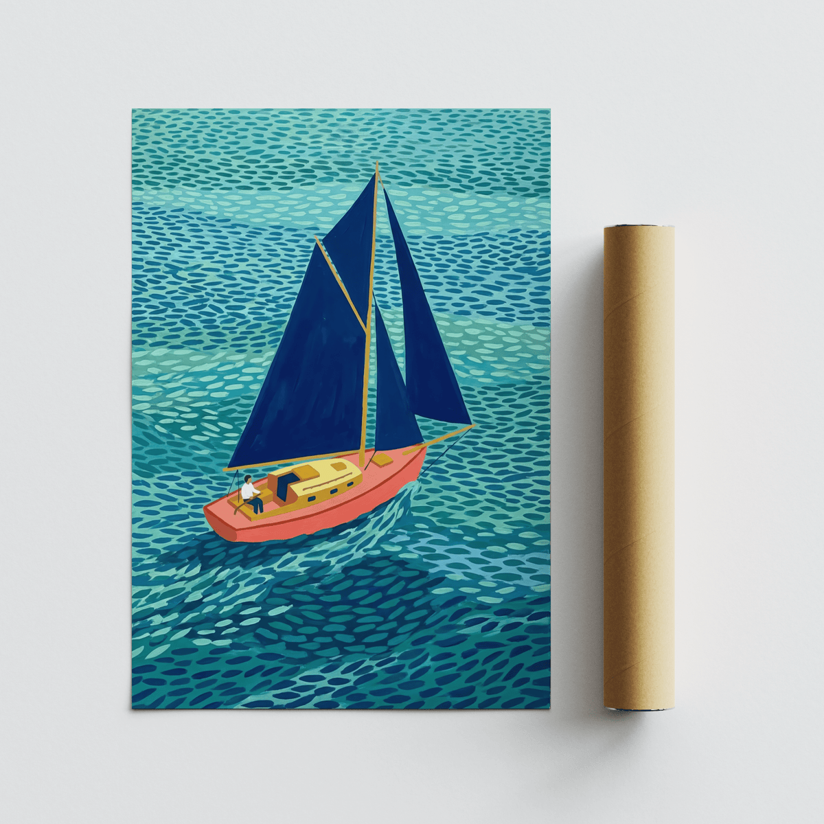 Colorful Sailboart Poster flat laid beside a brown packaging tube showing a sailboat with blue sails and a coral hull