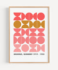 Modern Bauhaus geometric wall art in coral and ochre, perfect for mid-century decor
