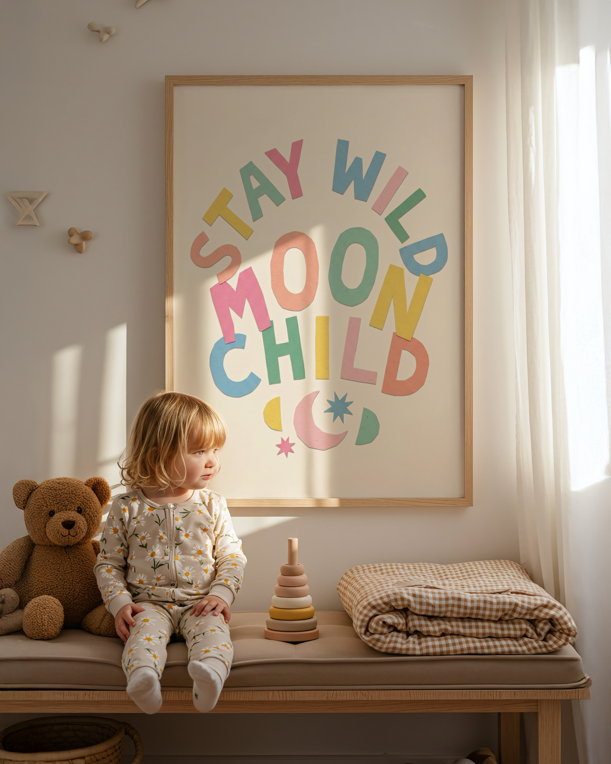 Cut-paper style Moon Child Wall Art with multicolored letters and simple celestial icons