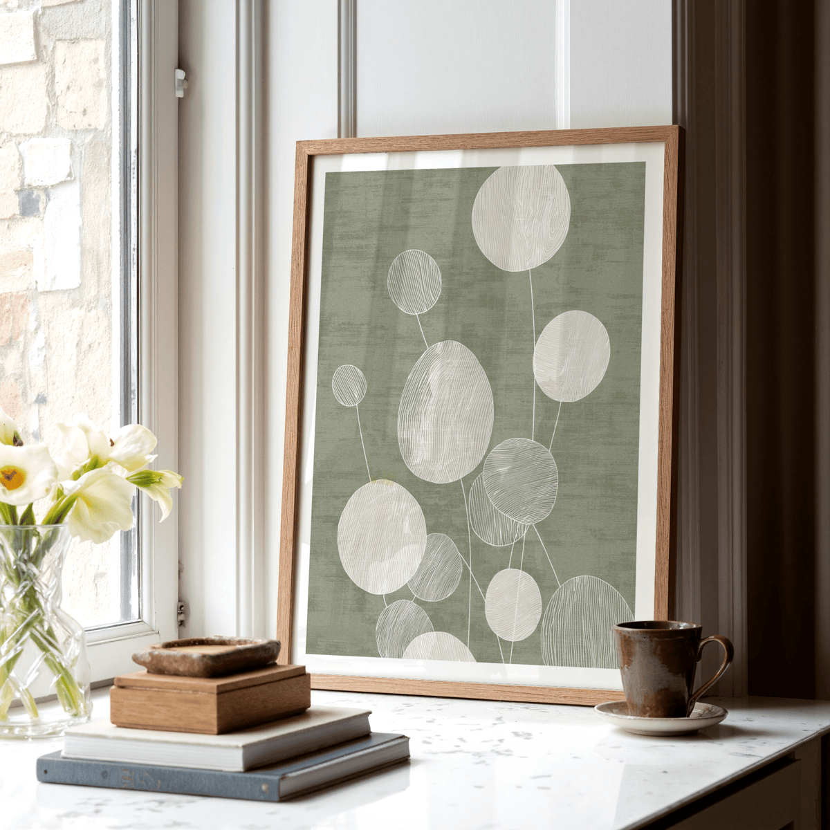 Green and white botanical wall art with overlapping circle forms