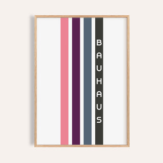 Framed geometric art wall print with vertical stripes in pink, purple, blue, and black with text