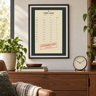 Vintage time card retirement print above a wooden sideboard in a living room