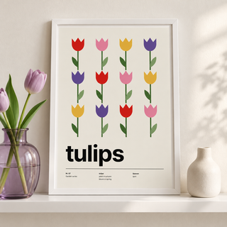 Rows of colourful tulips leaning on a picture ledge with books