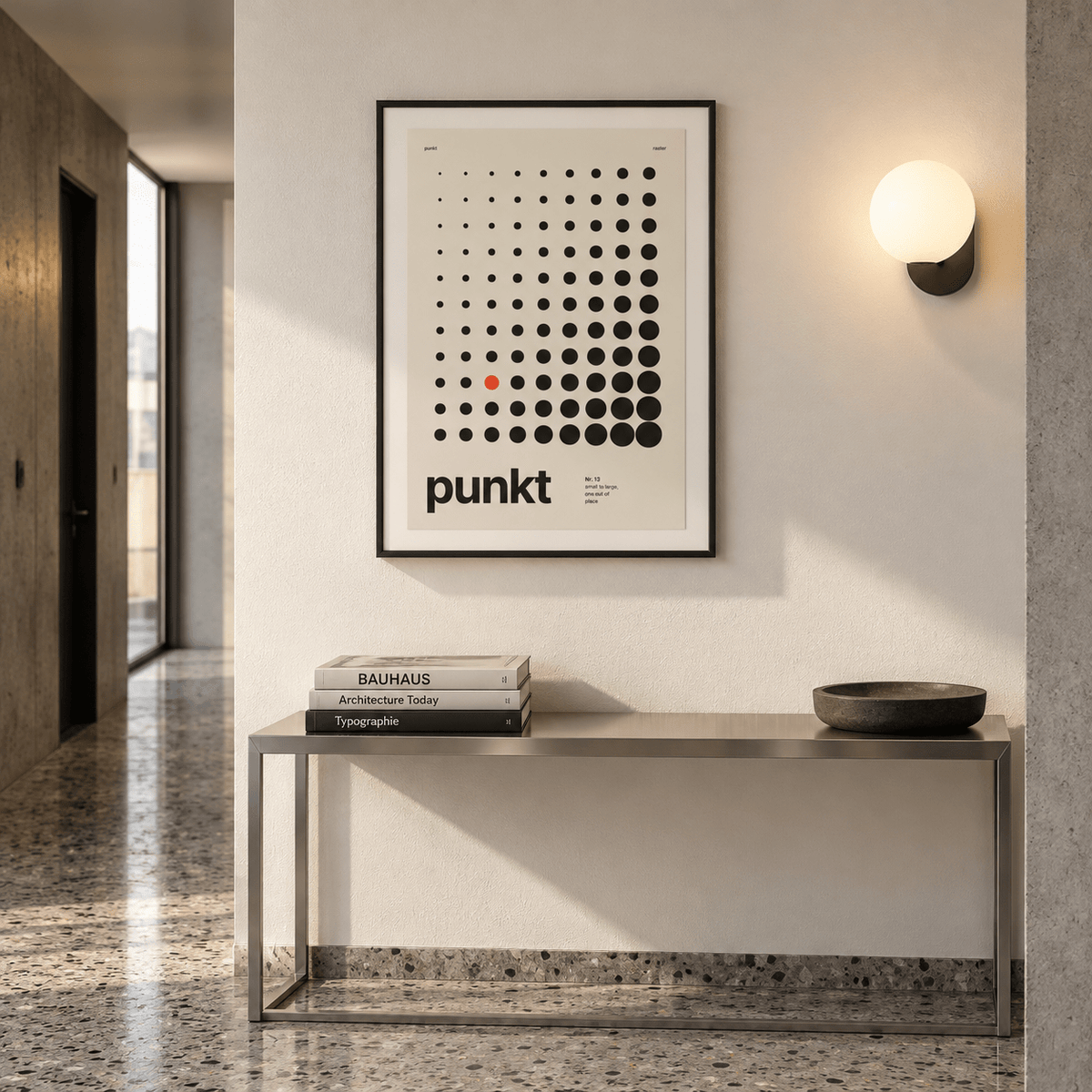 Black dots growing in size print above a console table in a hallway