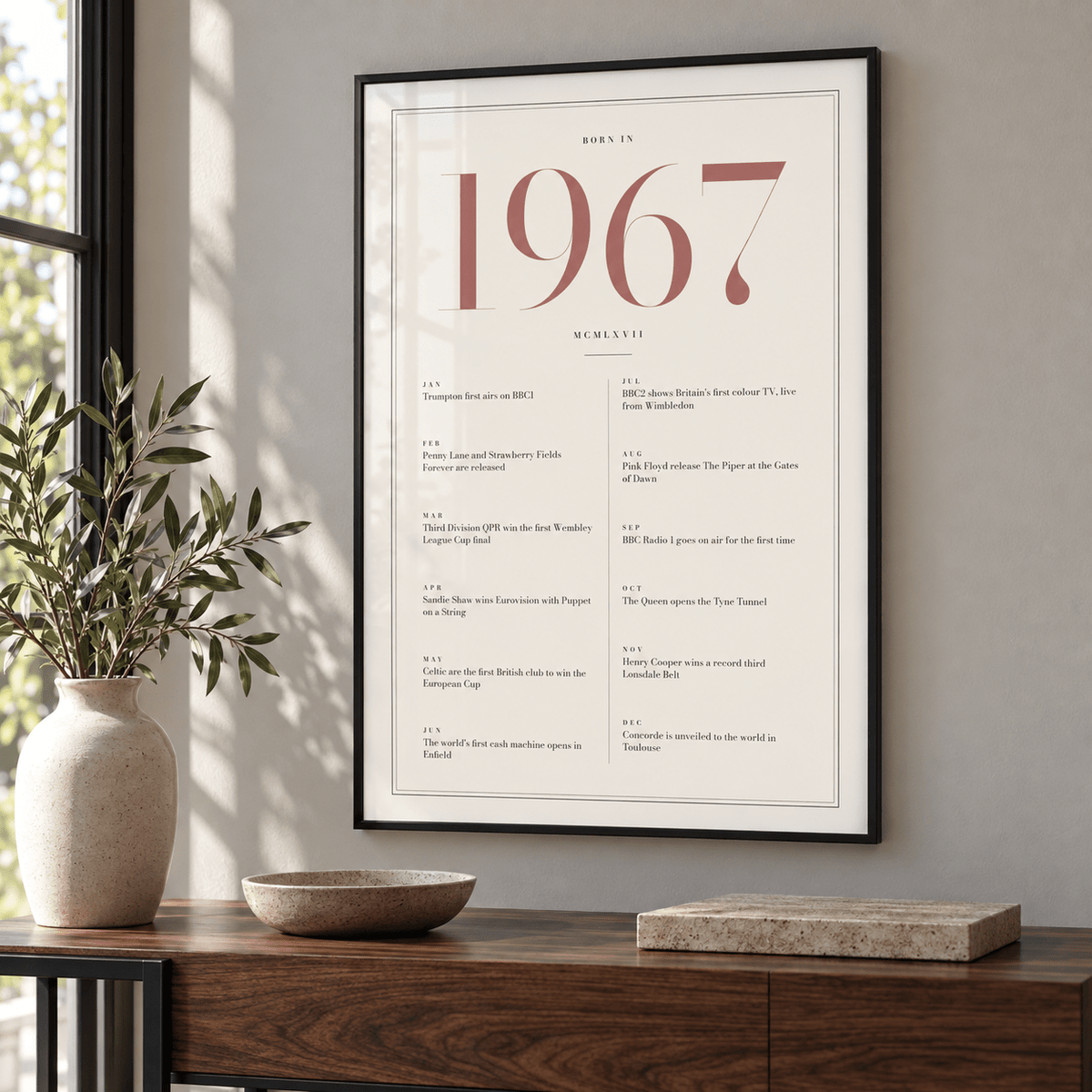 Cream and dusty rose 1967 birth year print in a calm room setting