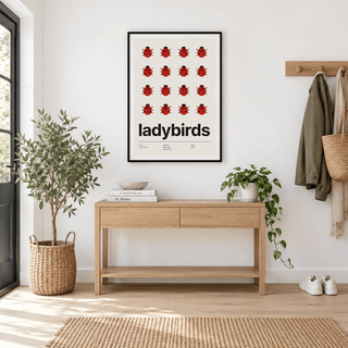 Sixteen red ladybirds in a grid above a console table in a hallway