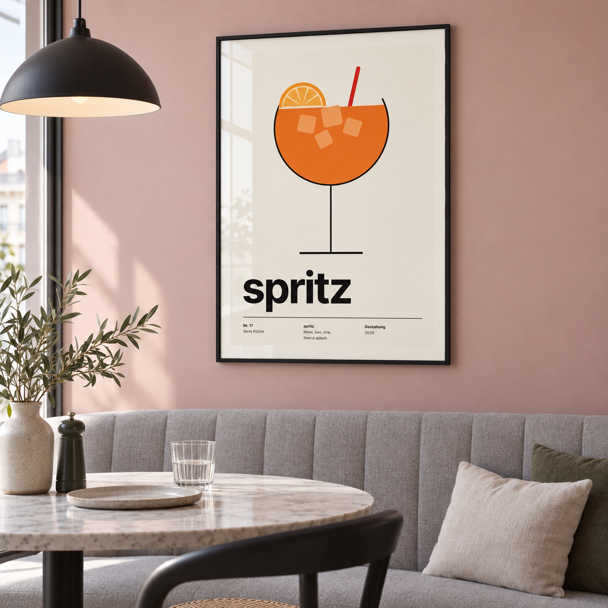 Spritz with ice and orange wheel print above a banquette in a dining
