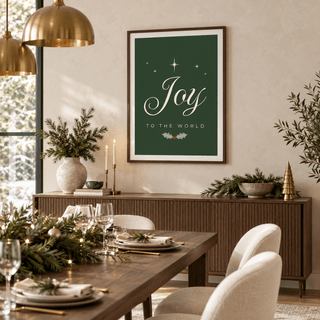 Joy script print above a walnut sideboard in a dining room set for Christmas