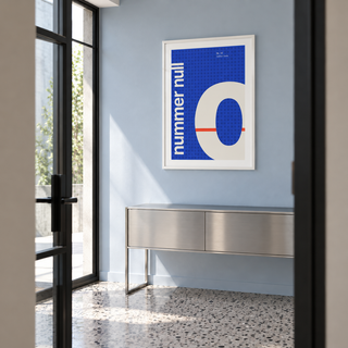 Number zero typography print above a console table in a hallway