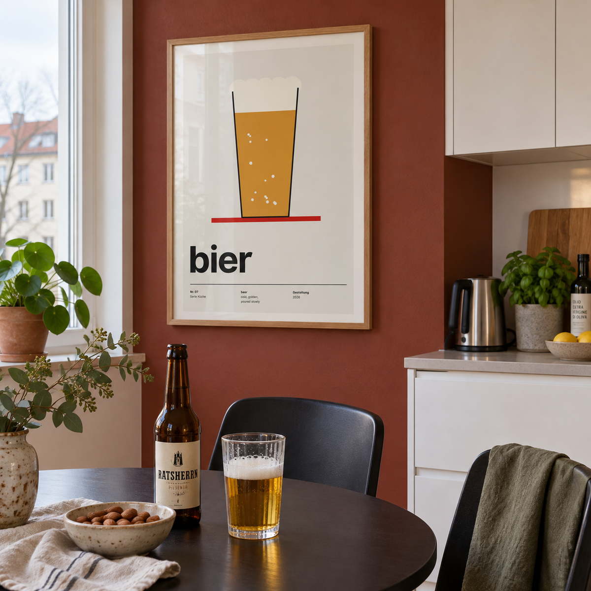 Swiss style beer glass print in a kitchenette against a red wall