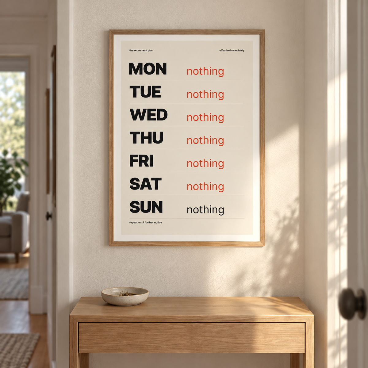 Monday to Sunday nothing print on the wall of a bright hallway