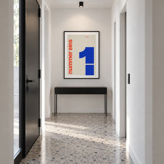 Number one typography print above a console table in a hallway