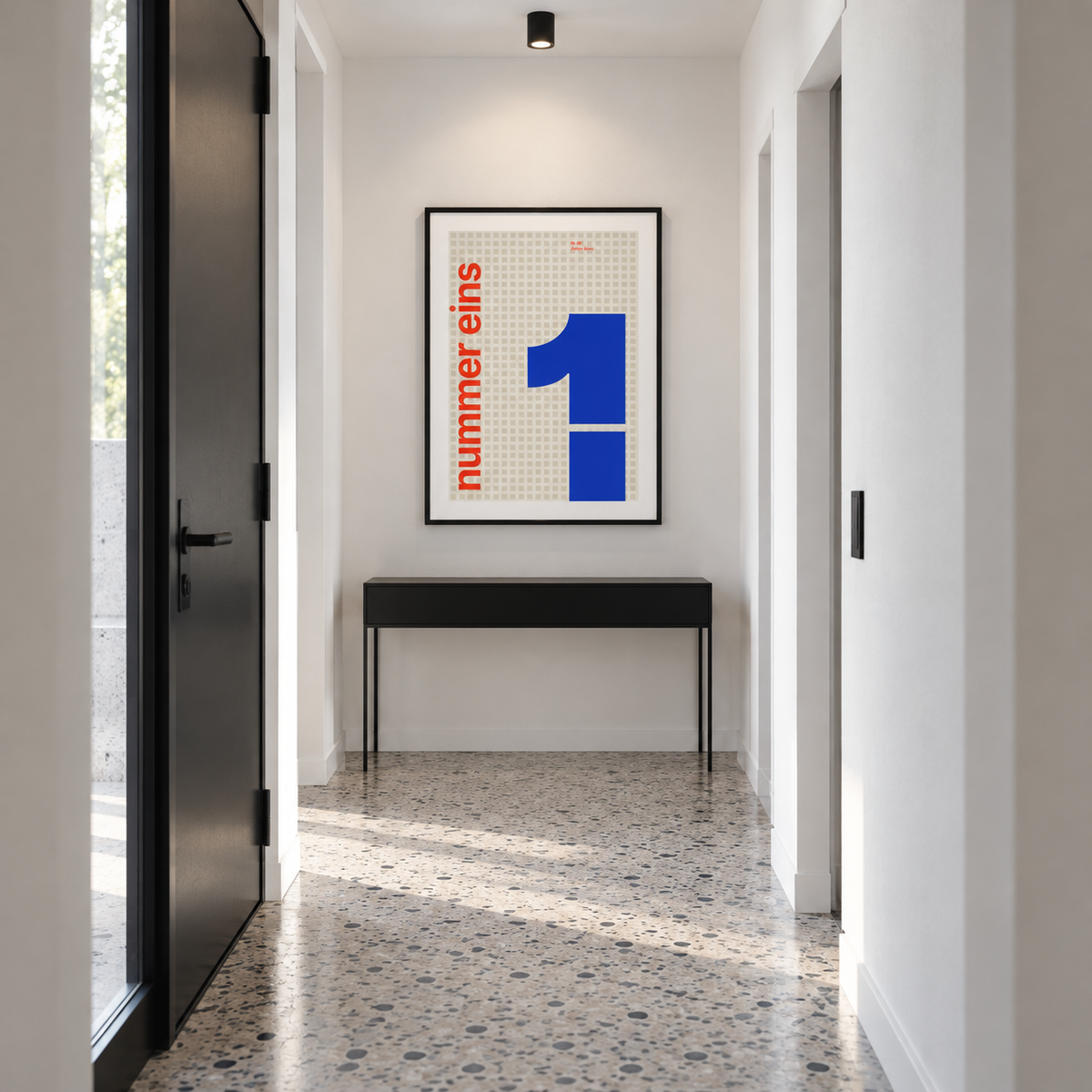 Number one typography print above a console table in a hallway