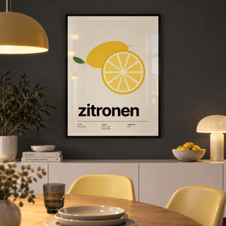 Yellow citrus slice print above a sideboard in a dining against a charcoal wall