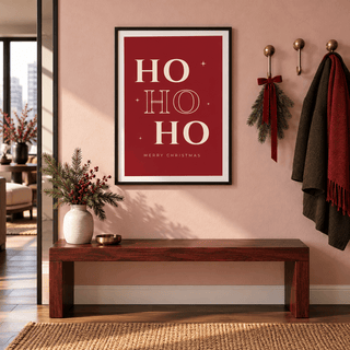 Bold red Christmas lettering print in a modern entryway at Christmas