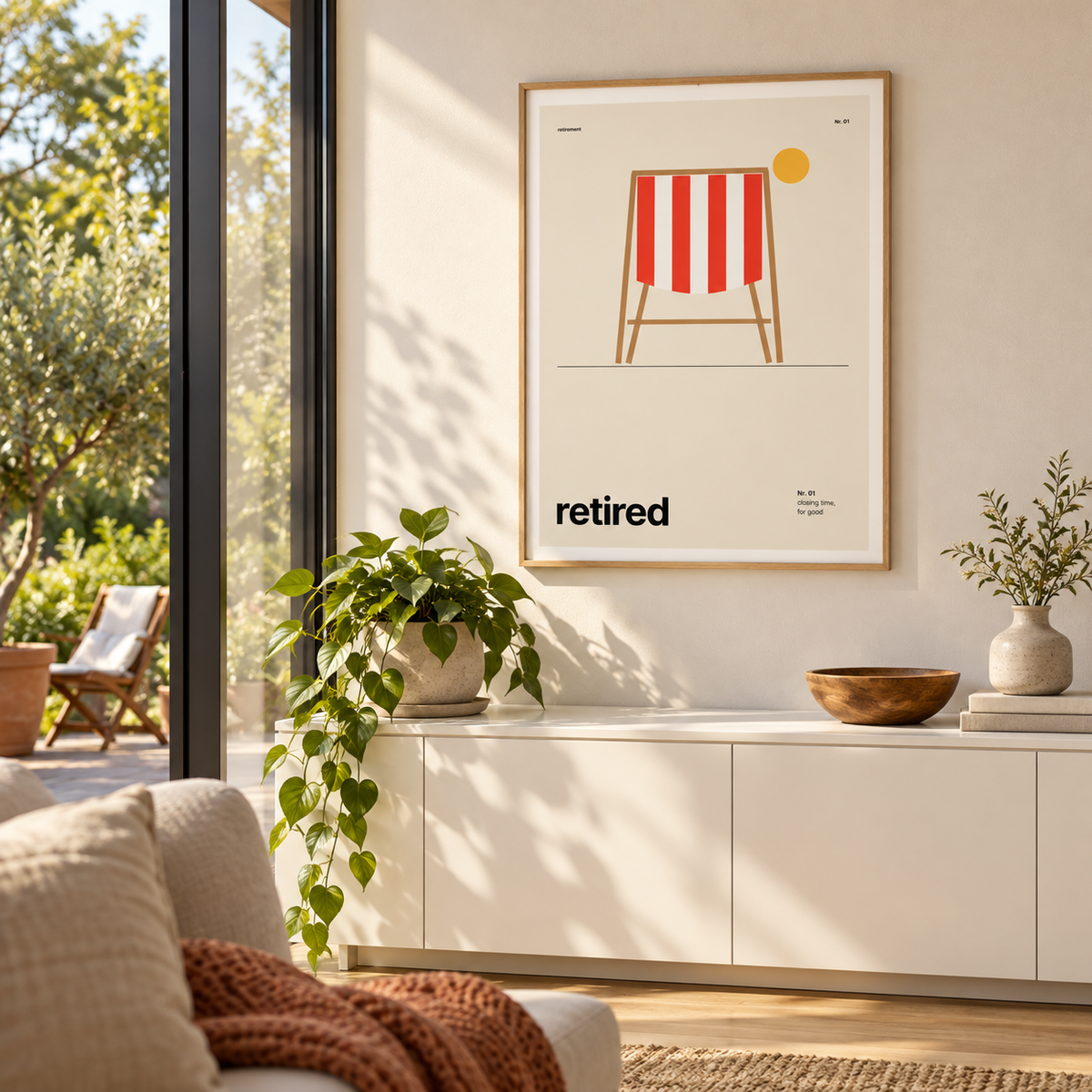 Red and cream deckchair print beside a patio door in a garden room
