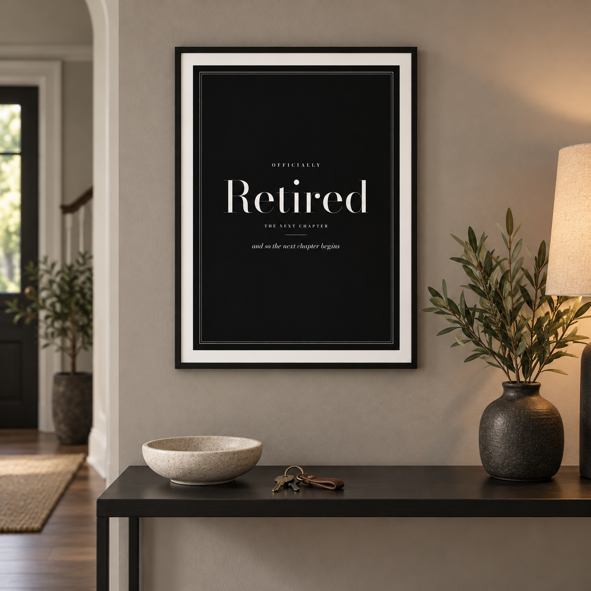 Black and cream retirement print on the wall of a bright hallway