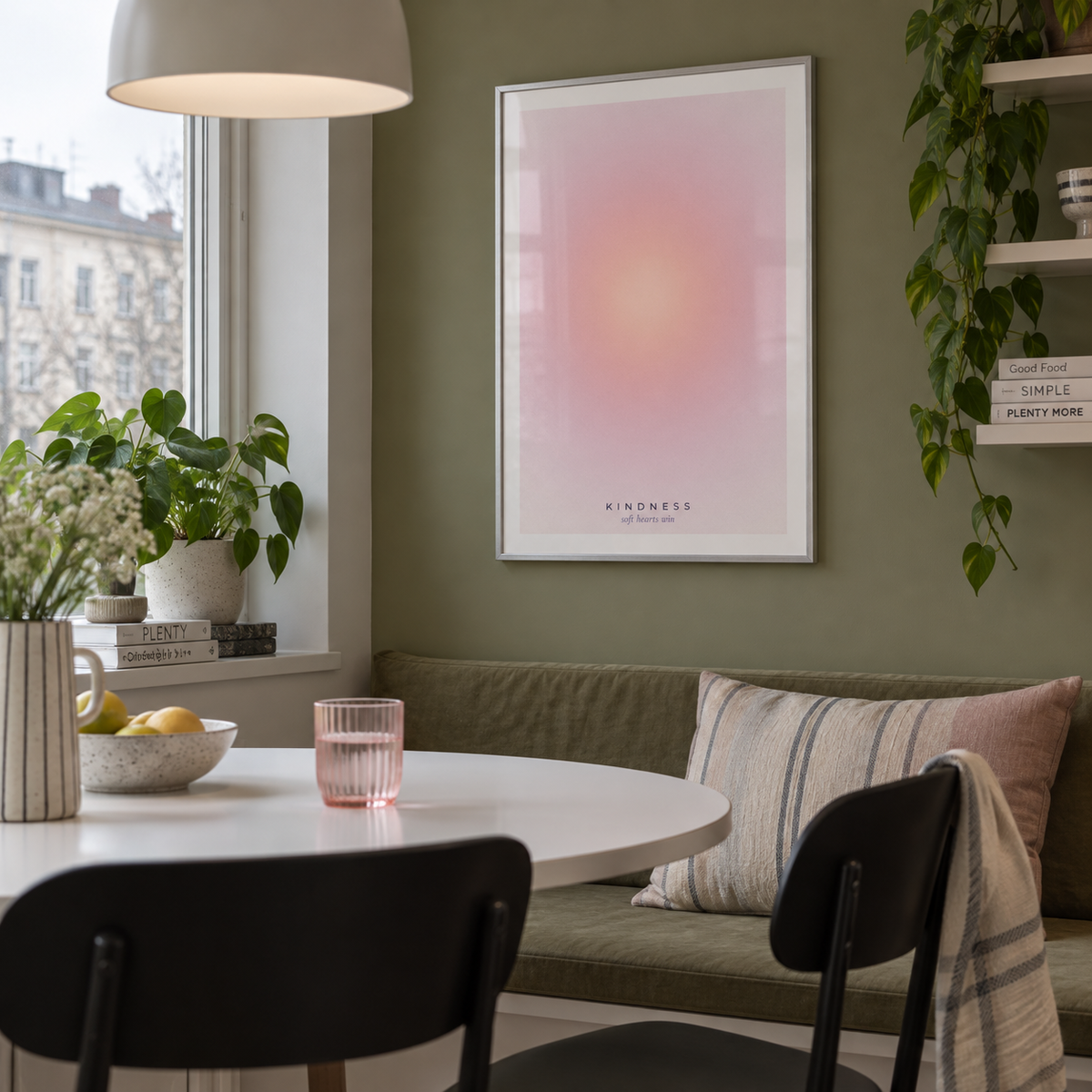 Soft peach and pink halo print in a kitchen dining against an olive wall